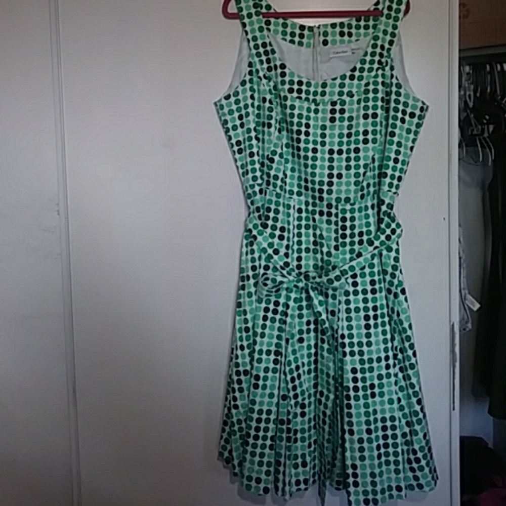 Tea-length green polka dot dress